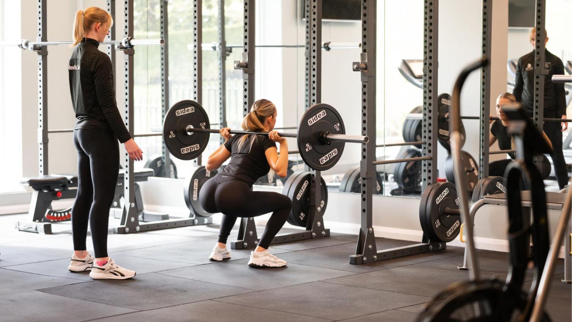 The Culloden Estate And Spa Holywood  Esterno foto A woman performing a back squat with a barbell